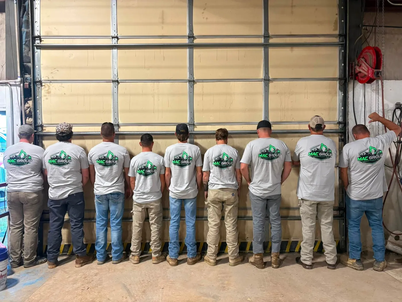 The Mac Group Construction team lined up in company shirts