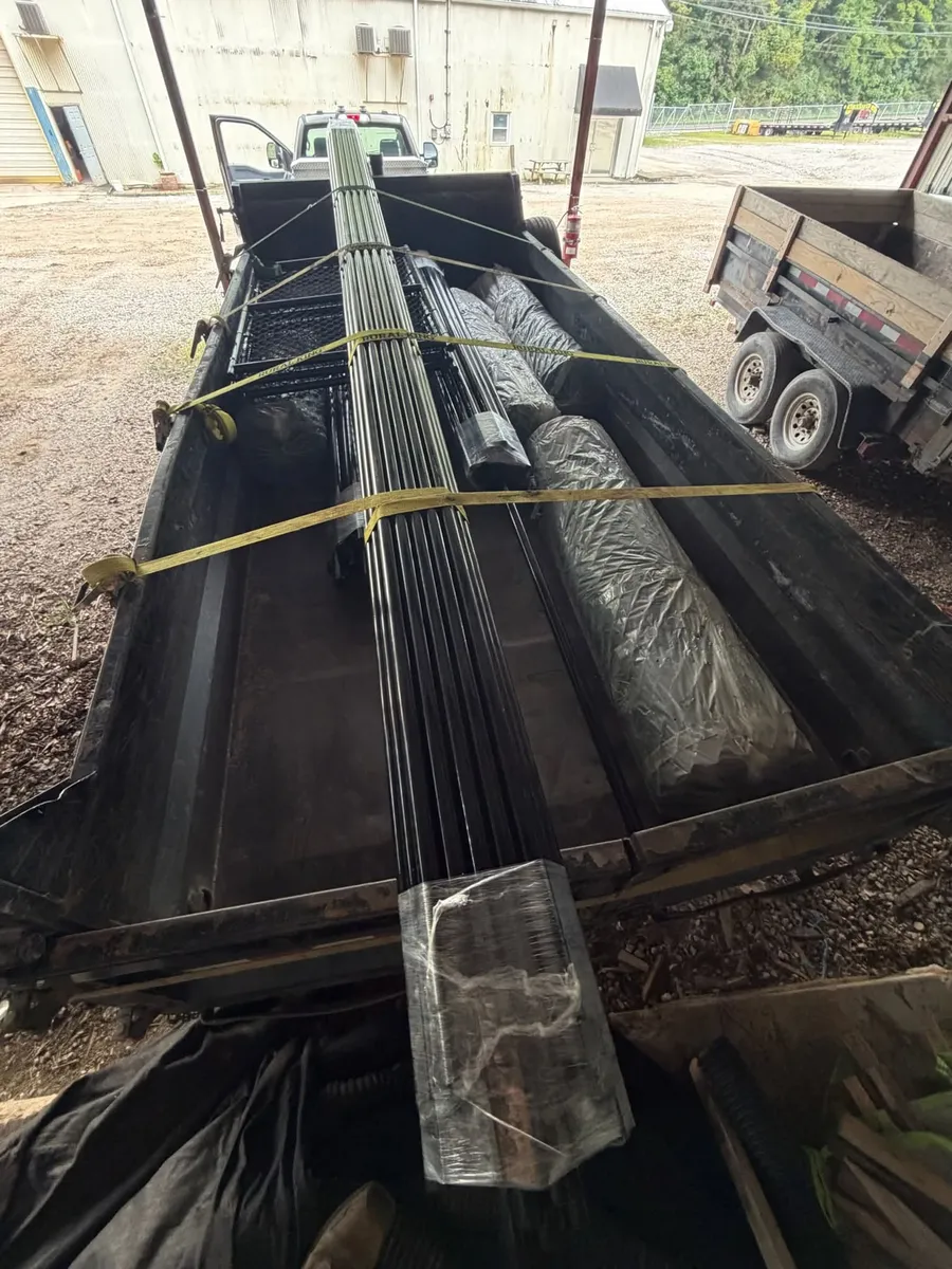 Helical tie-back foundation repair materials loaded on a trailer